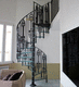 spiral staircase / glass step / steel frame / home