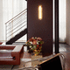 modern wall light / indoor / polished brass / glass