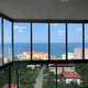 sliding patio door / folding / aluminum / double-glazed