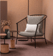 contemporary armchair / leather / fabric / steel