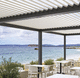 self-supporting pergola / wall-mounted / aluminum / with mobile slats