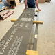 wall-mounted signage plate / stone / enameled lava / lava