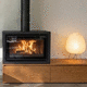 wood heating stove / free-standing / central / minimalist design