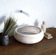 countertop washbasin / natural stone / round / contemporary