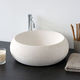 countertop washbasin / natural stone / round / contemporary