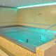 wall swimming pool / indoor / built-in / stone
