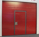 sectional industrial door / steel / fire-rated / glazed