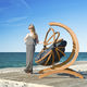 original design hanging chair / wooden / for public spaces / outdoor