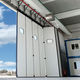 hangar industrial door / folding / metal / automatic