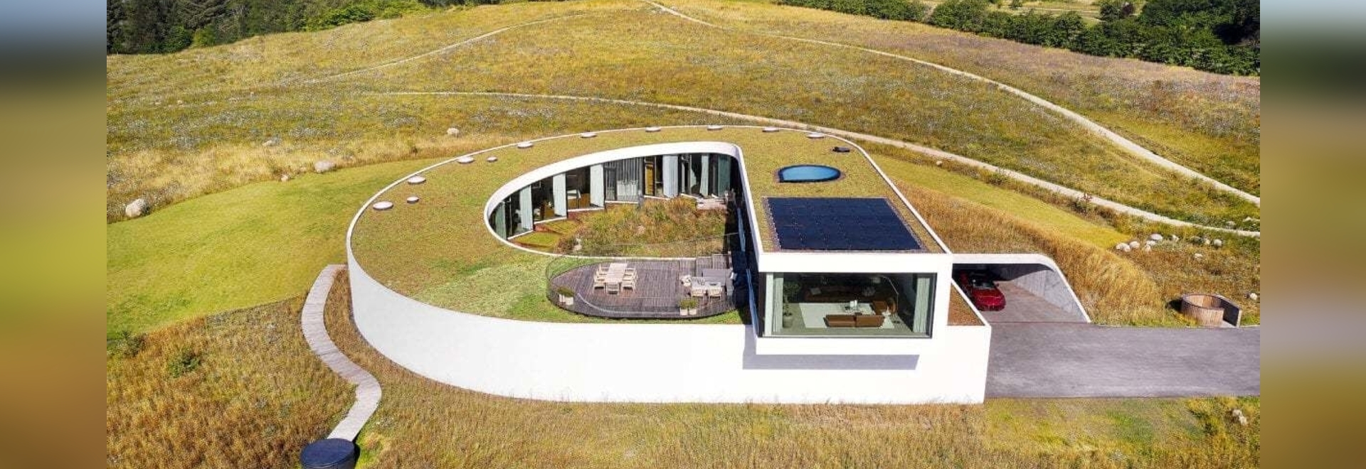 BIG completes slithering Villa Gug on the countryside hills of northern Denmark