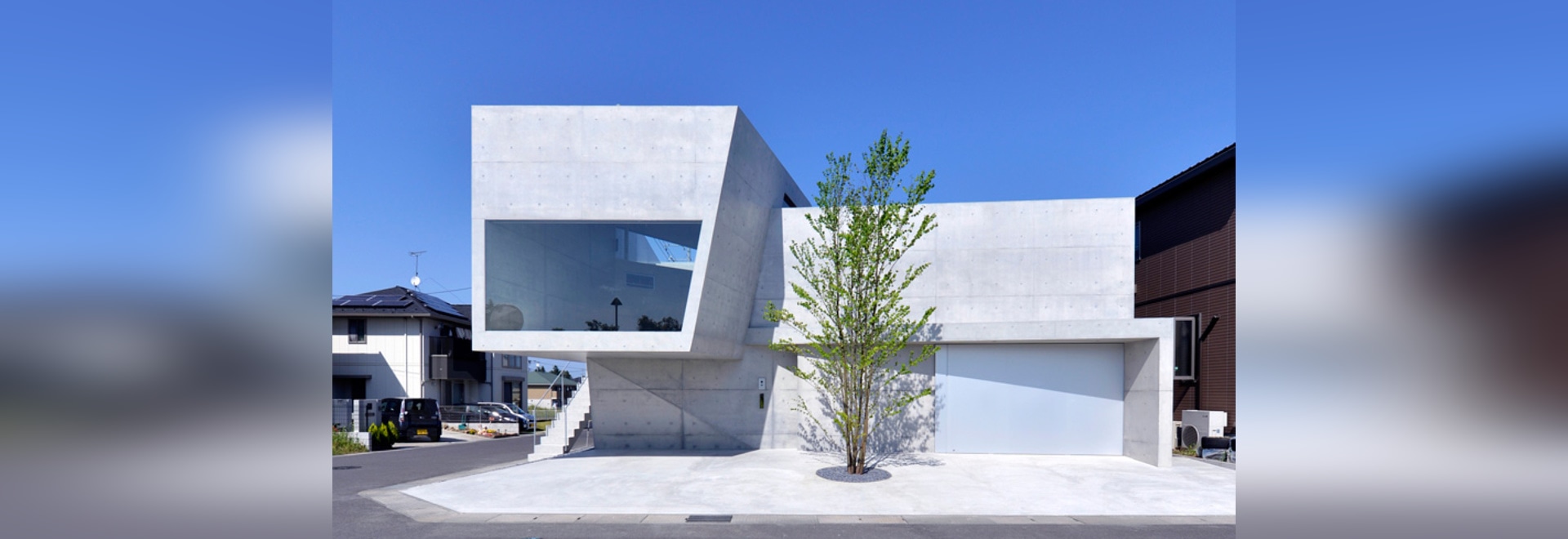 fuse-atelier's house in tsutsumino is composed of concrete volumes ...