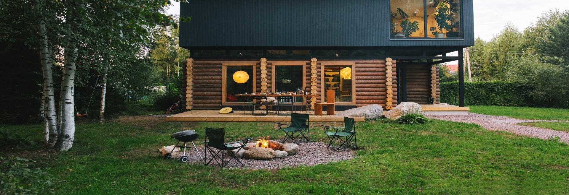 A Pile Of Logs From An Old House Were Used To Create The Bottom Half Of This New Home