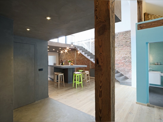 ARCHITECT TANJA MEYLE DIVIDES LOFT WITH CONCRETE BOX