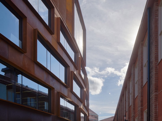 Tham & Videgård's Stockholm architecture school features a curving skin of pre-rusted steel