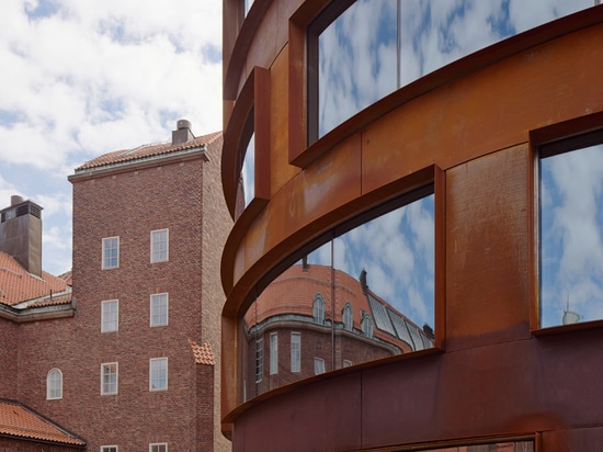 Tham & Videgård's Stockholm architecture school features a curving skin of pre-rusted steel