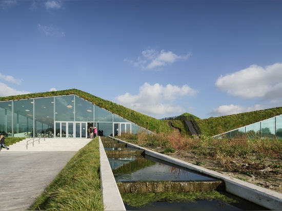 Studio Marco Vermeulen adds grass blanket over rooftop pyramids of Dutch island museum