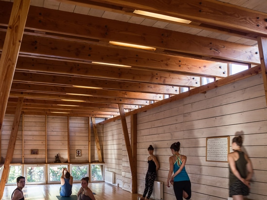 DX Arquitectos extends yoga teacher's house with a blackened timber studio on top