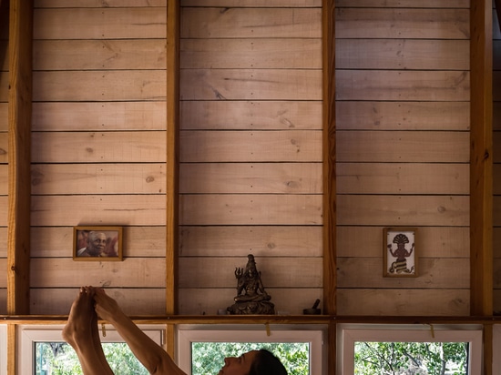 DX Arquitectos extends yoga teacher's house with a blackened timber studio on top