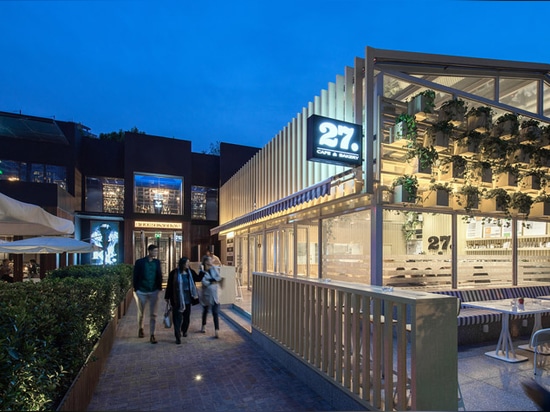 Four O Nine transforms greenhouse into plant-lined coffee shop