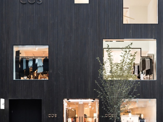 Blackened cedar planks cover the facade of COS Toronto store