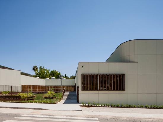 chamfered edges soften the junction with street