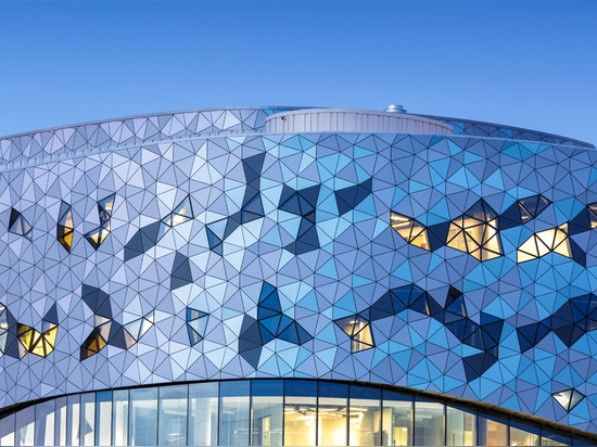 the undulating façade is comprised of a series of triangles positioned according to a precise and complex algorithm