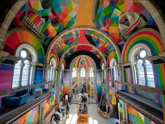 okuda san miguel paints colorful mural within converted church's indoor skate park