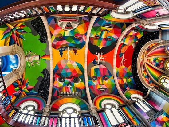 okuda san miguel paints colorful mural within converted church's indoor skate park