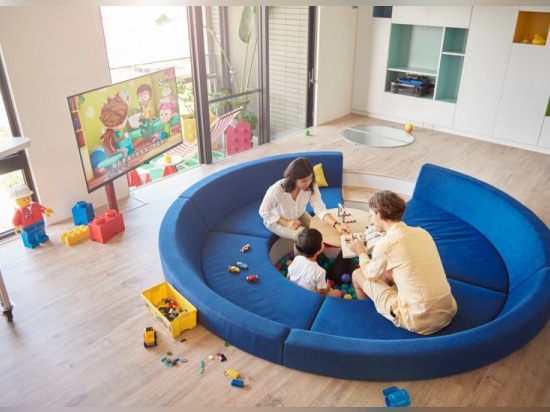 In other homes, the television would serve as the primary source of entertainment… but any young kid would surely find the ball pit to be the main attraction in this fun-filled design.