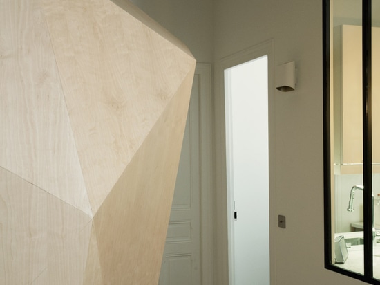 Atelier 37.2 installs sculptural wooden bathroom inside Haussmann-era apartment