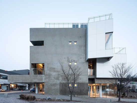 Maxcube by Studio Koossino houses creative workspaces within concrete walls