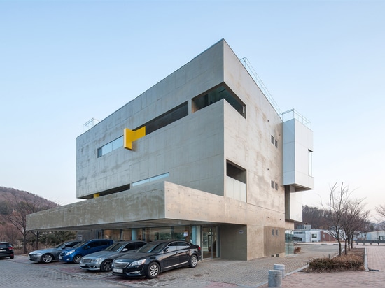 Maxcube by Studio Koossino houses creative workspaces within concrete walls