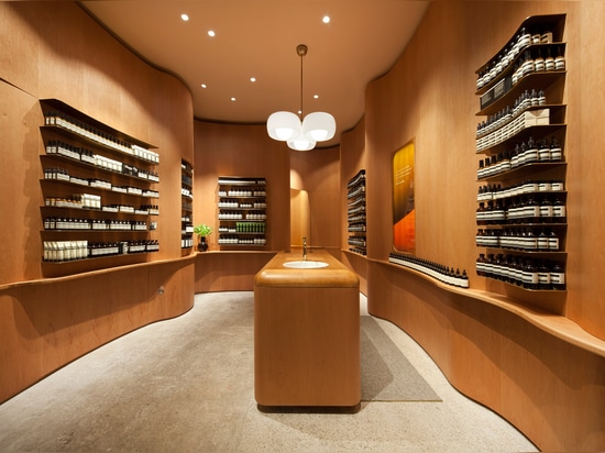 In Praise of Shadows creates undulating wooden walls for Stockholm Aesop store