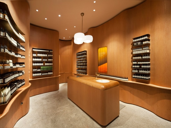 In Praise of Shadows creates undulating wooden walls for Stockholm Aesop store