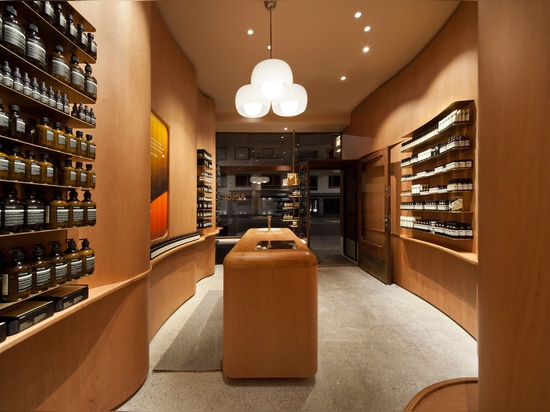 In Praise of Shadows creates undulating wooden walls for Stockholm Aesop store