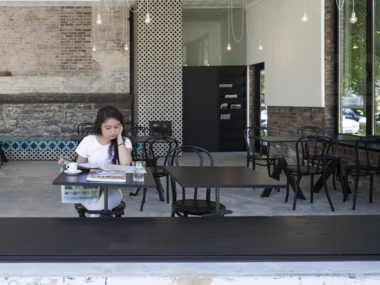 the space between the windows and the stove provides an open seating area for ever-changing seating patterns