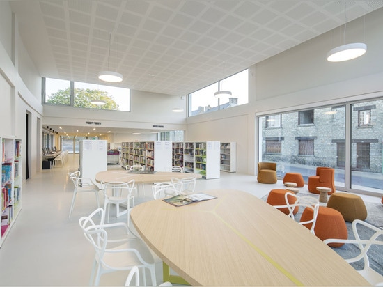 French village library by Studio 02 Architectes presents a gridded facade of wood and glass