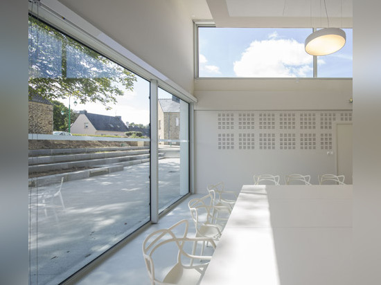 French village library by Studio 02 Architectes presents a gridded facade of wood and glass