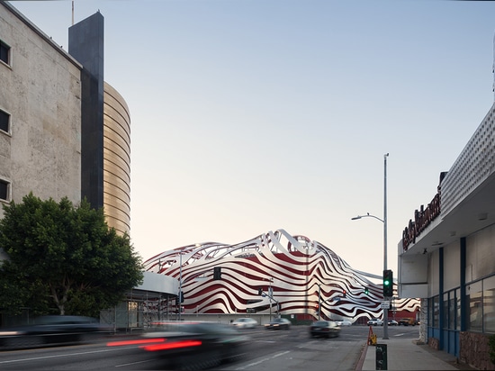 The architects drew inspiration from the form of a car to create the new building's streamlined and shimmering skin   Read more at http://www.wallpaper.com/architecture/kpf-transform-petersen-autom...