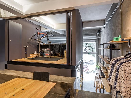 a small service shop is positioned directly above the kitchen, contained within a concealable volume