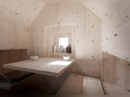 Mountain hideaway hidden inside a concrete boulder in the Alps