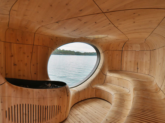 Seams in the cedar panels and ventilation 'pores' carved into the seats allow the space to breathe