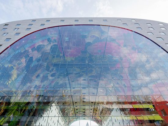 MVRDV's ambitious Markthal building opens in Rotterdam, housing a busy food market within its striking arch