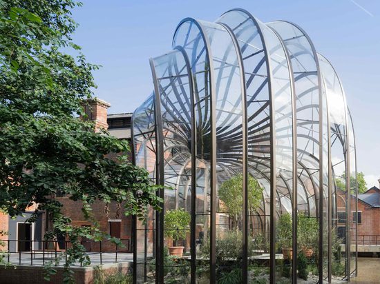 One of the glasshouses contains the distillery's tropical plants collection, while the other houses the Mediterranean plants. Photography: Iwan Baan