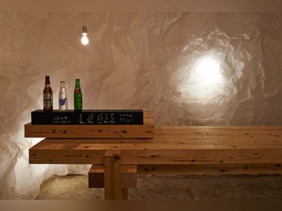 Naoya Matsumoto Design uses crumpled paper to create grotto-like bar in Osaka