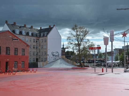 The wall from which the cement slide starts, just as the slide itself, will be soon coated in red: the park will appear as sloping from the house and the skaters, who already crowd the site at nigh...