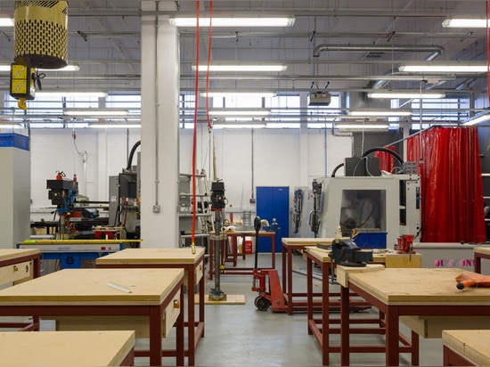 Hawkins\Brown uses wooden partitions to create temporary warehouse home for The Bartlett