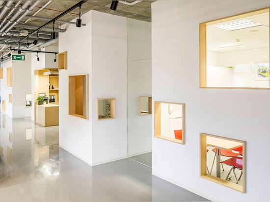 MFRMGR creates house-like cubicles with windows inside a Polish office