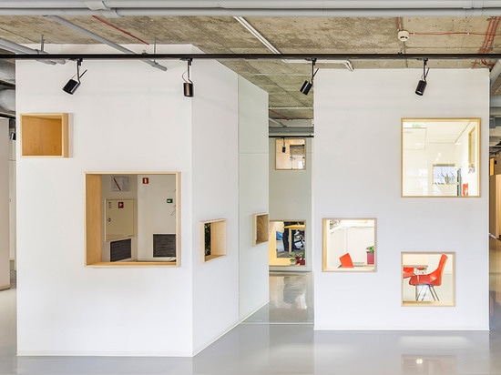 MFRMGR creates house-like cubicles with windows inside a Polish office