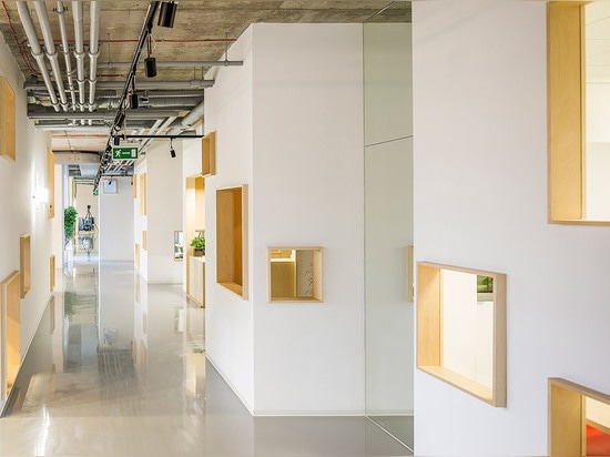 MFRMGR creates house-like cubicles with windows inside a Polish office